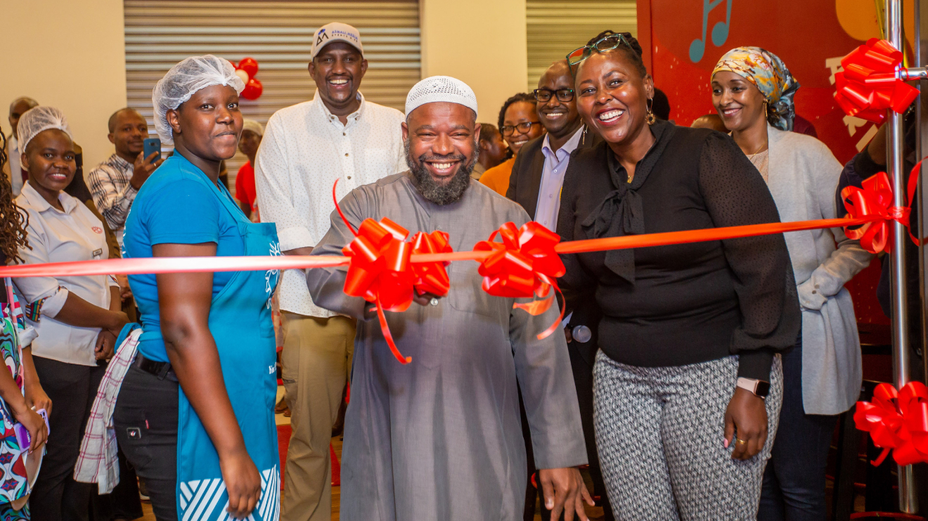 L-R Charity Nthenya, businessman Asmali Ahmed (in the background), Imam Sheikh Abu Sufyan and Priscilla during the opening of the 84th Java House. PHOTO/COURTESY